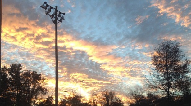 Sunset over the baseball field area. 