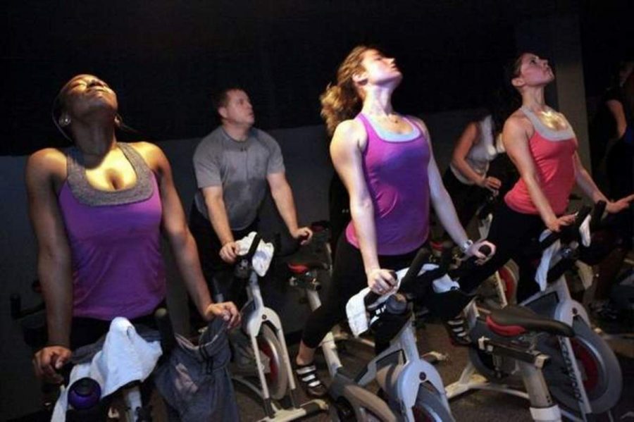 Velovoom involves performing yoga moves like the cobra, demonstrated here, while pedaling. Photo via The Washington Post.  