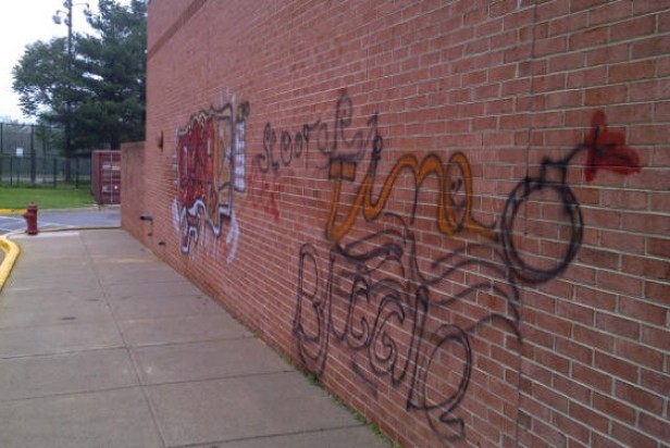Graffiti covers the wall of Pyle Middle School. Police are currently investigating the incident. Photo by Eyal Hanfling.