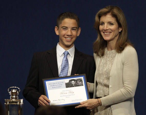 Caroline Kennedy presents a first place award to junior Kevin Kay for the JFK essay contest. Kay will receive $10,000 dollars. Photo by Stephan Savoia for AP. 