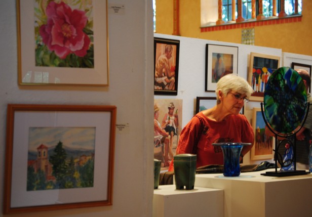 Local art connoisseurs check out stained glass, pottery and paintings at the 41st annual Glen Echo Art Show. This years show, which runs from Sept. 3 to 5, features over 200 artists. Photo by Julia Berard.  