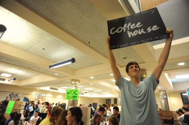 Senior Luke Graves promotes the club Coffeehouse at Club Night Sept. 20. At Club Night, parents and students discover new extracurricular activities. Photo by Billy Bird. 