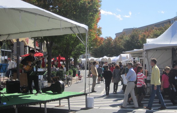 Locals enjoy the art galleries and live music at the 14th annual Bethesda Row Art Festival Oct. 15 and 16. Over a hundred artists, from painters to sculptors to photographers, showcased their work. Photo by Deanna Segall.