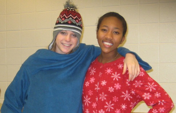 Juniors Linn Bumpers and Ameera Crossman are warm and toasty in their pajamas. Pajama Day is the first day of homecoming spirit week. Photo by Julia Berard.