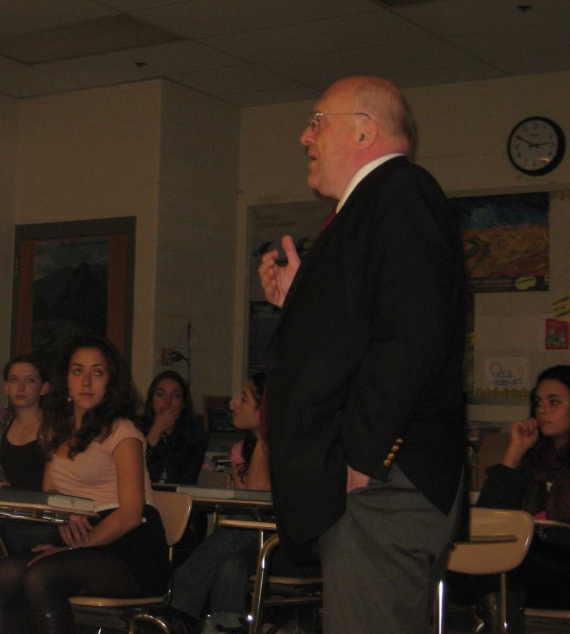 World Bank demographer John May speaks to members of the French Honors Society Nov. 22. He discussed population trends around the world and the various causes of population growth. Photo by Carolyn Freeman.