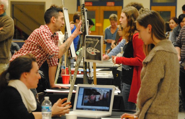 College representatives critique students artwork at the 10th annual Art School Forum last night. The workshop, the only one of its kind in the county, allows students to gain feedback to work on their portfolios for art school. Photo by Julia Berard.