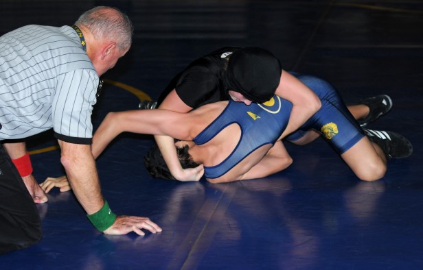 106 lb. wrestler Harriet Symington battles a member of the Gaithersburg Trojans. The Vikes dominated the Trojans, 51-27, to remain undefeated. Photo courtesy Aidan Leighton.