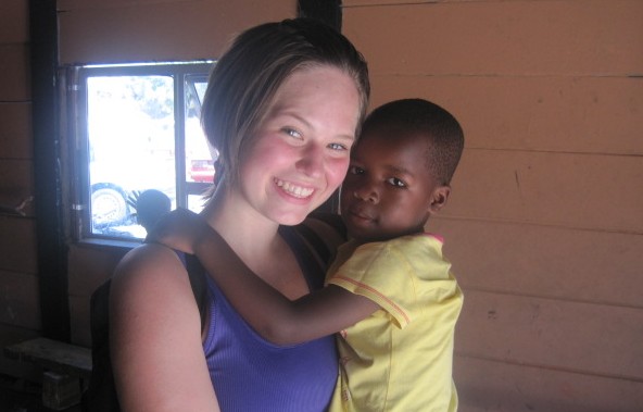 Junior Ali Foreman holds a local South African child during a visit to a township. Foreman spent six weeks in South Africa as part of an exchange trip. Photo courtesy Ali Foreman.