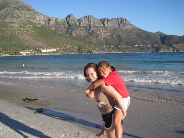 Junior Ali Foreman (left) and Emma, one of her host sisters, enjoy a beautiful day by Hout Bay. Foreman and the other exchange students have also visited a wildlife park and Robben Island, among other excursions. Photo courtesy Ali Foreman.