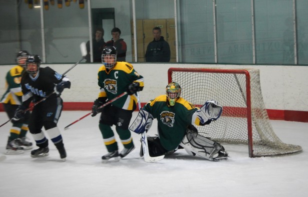 Raiders goalie Tommy Pappas slides to block a shot from the Vikes. The Vikes lost to the Raiders, 3-2, to end their playoff hopes. Photo by Melissa Kantor.