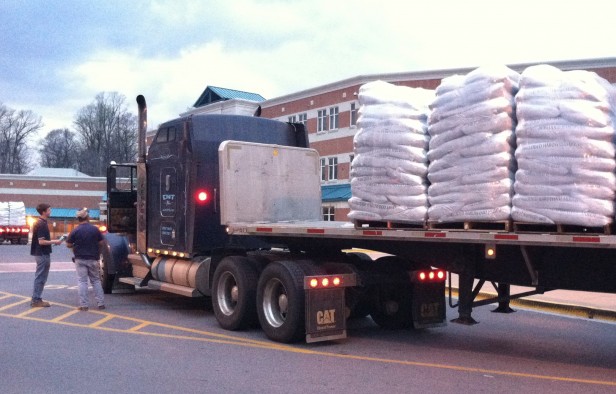 Workers deliver mulch to school this evening in preparation for the annual Whitman All Sports Boosters Mulch Sale. Come to the parking lot starting at 8:00 a.m. Saturday morning to pick up Photo by Annie Katz.