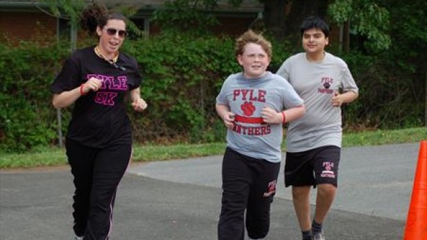 Two Pyle students and a Pyle teacher run during the 5K. Pyle hosted the 5K run May 10 in memory of Kayla Wenger, who passed away from cancer March 8. Photo courtesy Dawn Byington.
