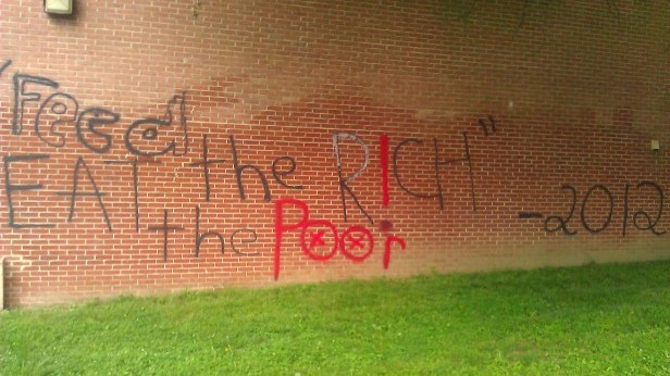 Students found graffiti written on the side of the building this morning. Photo by Jacob Cutler.