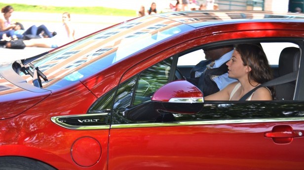 Senior Rachel Strauss drives the Chevy Volt during physics class. Physics students had the opportunity to drive the electric car during class May 18. Photo by Abigail Cutler.