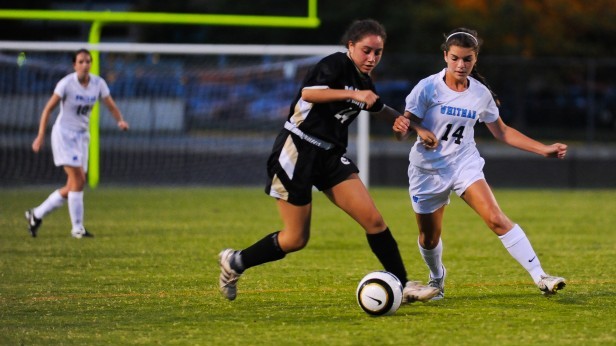 Forward Josie Schwartz battles for the ball as the Vikes defeat the Poolesville Falcons 2-1. Photo by Billy Bird.