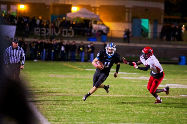 Running back Zac Morton runs past an opposing defender. The Vikes beat the Blazers 24-6 in a packed stadium on homecoming. Photo by Billy Bird.