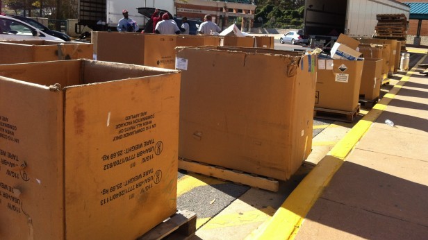 Electronic donations fill cardboard boxes that line the Whitman driveway. Photo by Tamar Meron.