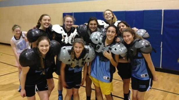The varsity girls basketball team practiced with football pads to prepare for overly aggressive opponents. Photo courtesy Dani Okon.