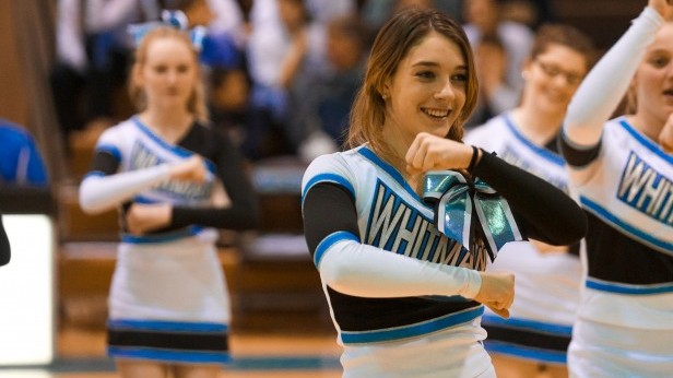 Junior Issie Griffith cheers at a basketball game Monday. The girls .............. Photo by Billy Bird.