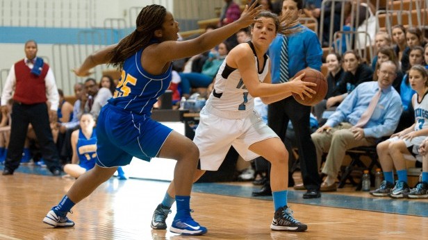 Guard Kim Durante looks for a pass against her Gaithersburg defender. Photo by Billy Bird. 
