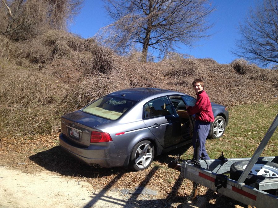 Senior Robby Lund enters his car parked across from the baseball field. After the administration contacted Montrose Towing and towed at least ten cars, many students without parking permits resorted to parking near the tennis courts to avoid the tow truck.
