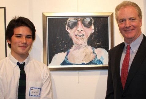 Senior Kai Valencia pictured with Congressman Chris Van Hollen and his award-winning acrylic painting named “Untitled” of a person with sunglasses