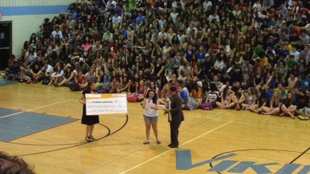 SGA Member and cancer survivor Marcela Falck-Bados presents a check to the Leukemia and Lymphoma Society for $91,761.16 at todays pep rally. The pep rally honored Walt Whitman High School for being the best fundraising school in the country. Photo by Raquel Weinberg.