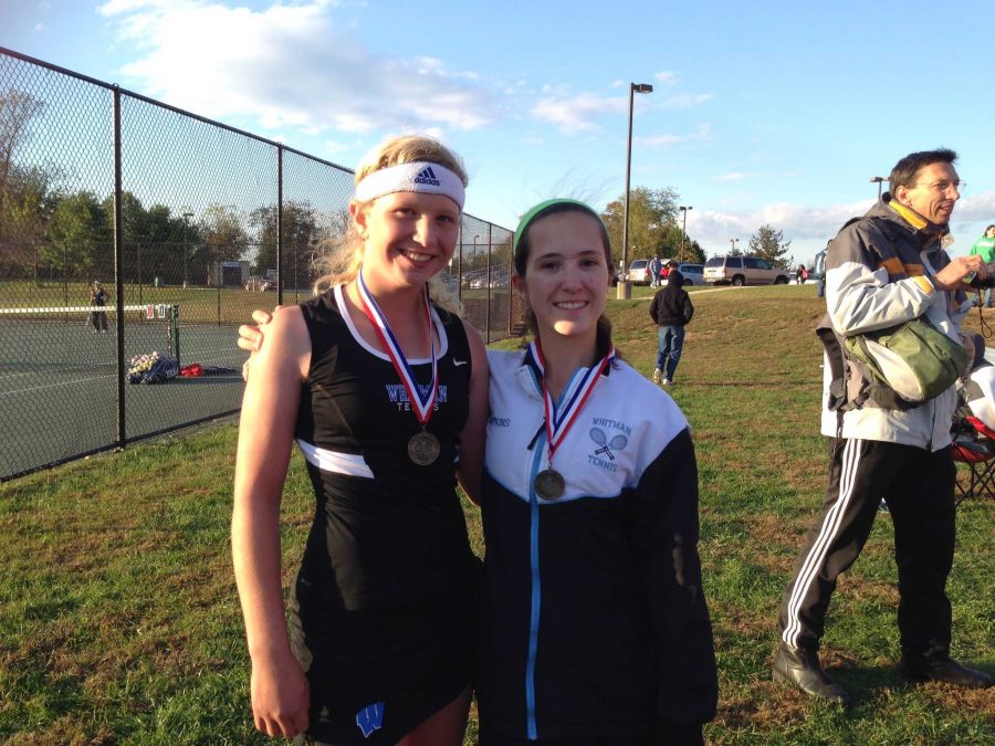 Emily and Miranda Tompkins pose with their medals. They took home ___Photo courtesy Olivia Tompkins. 