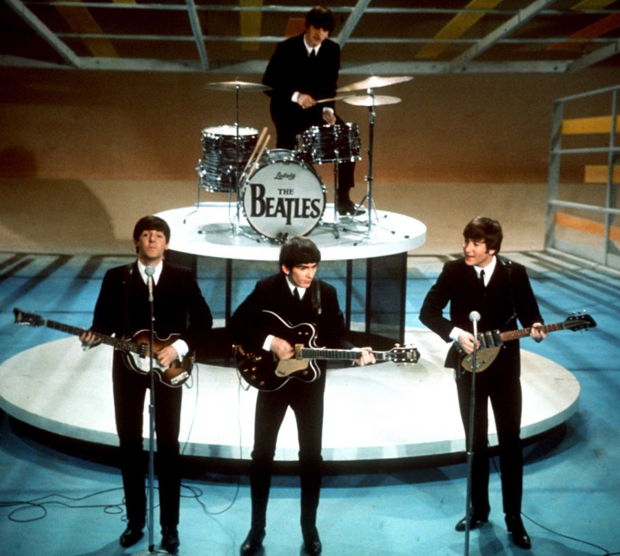 The Beatles perform on the CBS Ed Sullivan Show in New York Feb. 9, 1964. From left, front, are Paul McCartney, George Harrison and John Lennon. Ringo Starr plays drums. (AP Photo)