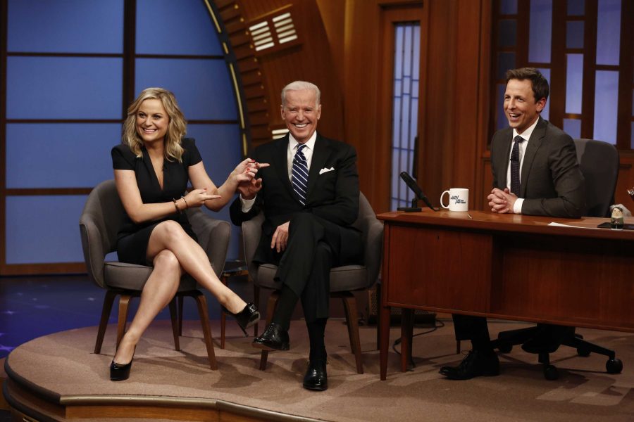 Actress Amy Poehler and Vice President Joe Biden appear with host Seth Meyers on the premiere of Late Night with Seth Meyers on Monday, Feb. 24, 2014, in New York. (AP Photo/NBC, Peter Kramer)