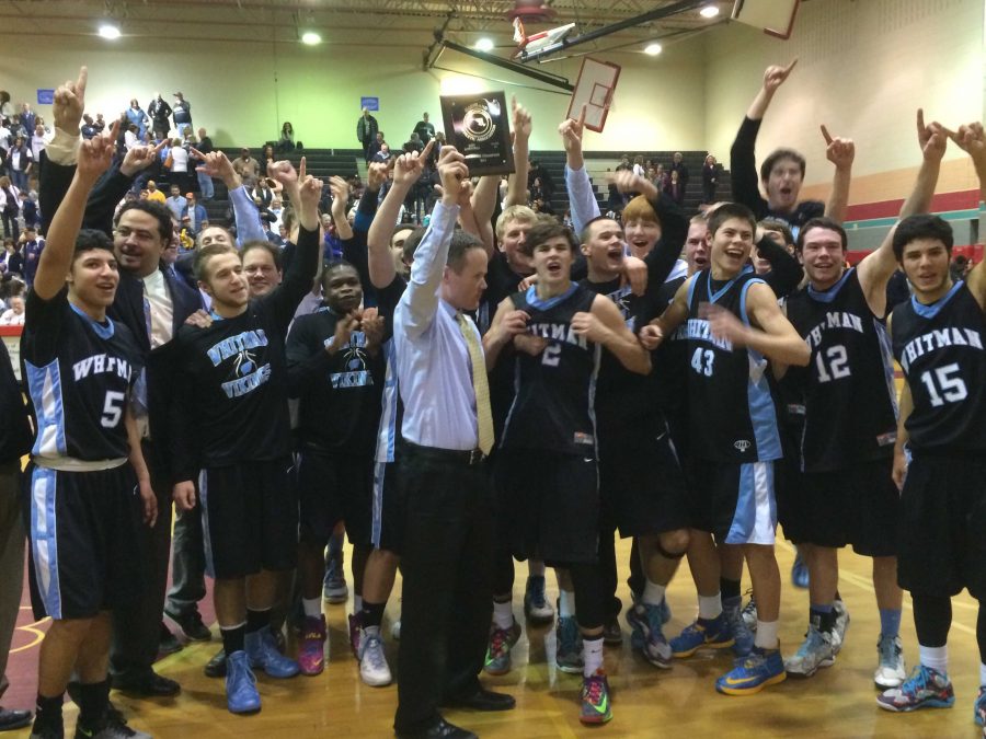 Coach Chris Lun and the Vikings celebrate the teams first regional championship since 2006. Photo by Ben Zimmermann.