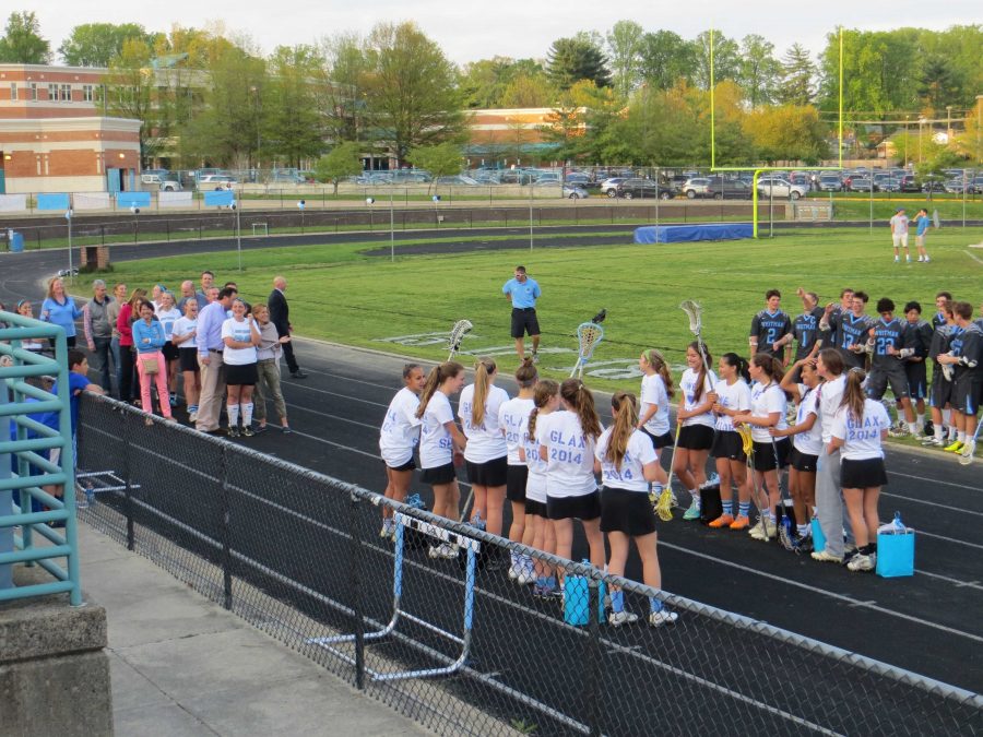 The girls lacrosse team lines up for their senior night before a 20-7 win over Clarksburg.  Photo courtesy Caleb Friedman.