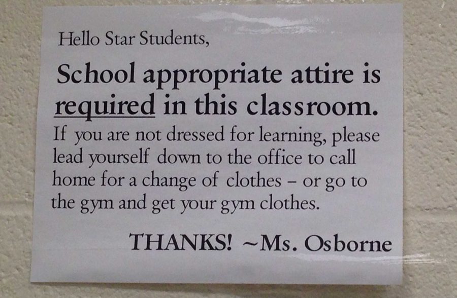 This sign is posted next to social studies teacher Courtney Osbornes door. Photo by Emily Baker.