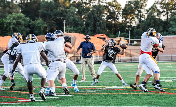Senior Evan Smith prepares to fire a pass in a preseason scrimmage against the Gaithersburg Trojans.  Photo by Chris Hanessian.
