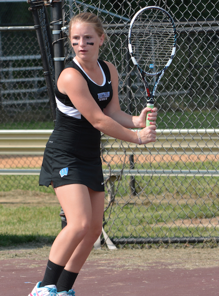 Third doubles player Olivia Matthews prepares to return a backhand. Photo by Shelley Dane.