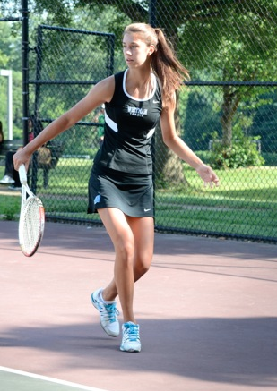 Fourth singles player Emily Meyers returns a backhand during Wednesdays match against B-CC. Photo by Michelle Jarcho.