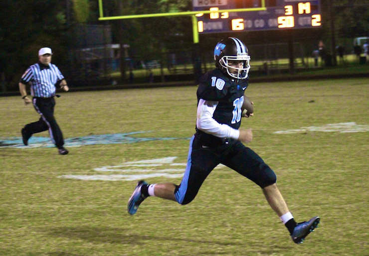 Quarterback Evan Smith tries to escape the Damascus pass-rush in the first half. Photo by Jonah Rosen.
