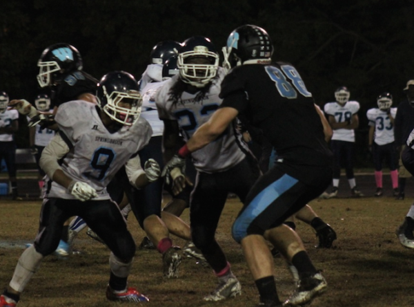 Tight end Anton Casey fights through a Sprinbrook double-team. Photo by Jonah Rosen.