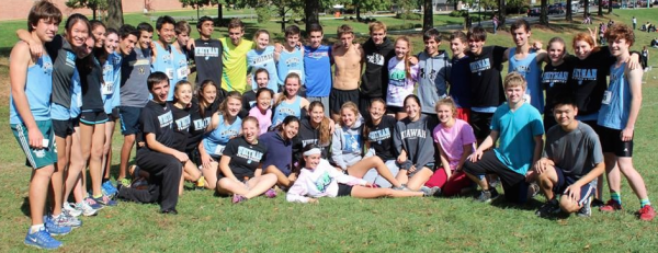 The cross country team poses for a photo after the boys and girls placed first and sixth respectively in counties.  Photo by Jean Waye.