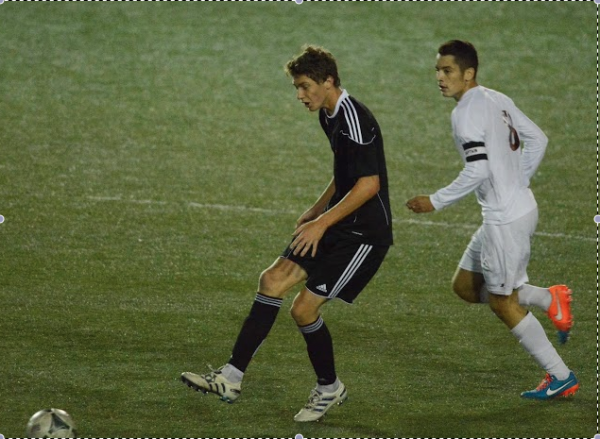 Midfielder David Voigt gets a steal. The Vikings defense had a solid showing against perennial powerhouse St. Benedicts, despite the 3-0 loss.  Photo courtesy Clive Harris.