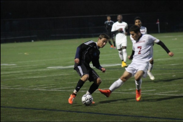 Defender Evan Goldsholle jukes out a Bladensburg defender before scoring the Vikings' fourth goal. Photo by Jonah Rosen.