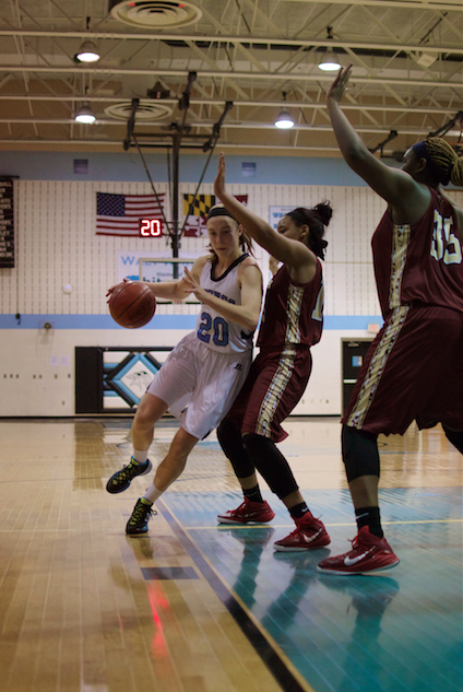 Guard Abby Meyers drives to the basket to score two of her game-high 28 points in Tuesdays 61-51 win over Paint Branch. Photo by Nick Anderson.
