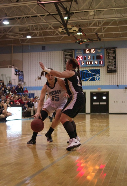 Forward Samantha Magliato drives to the basket against a Falcon defender. Magliato scored nine points in the win. Photo by Nick Anderson.