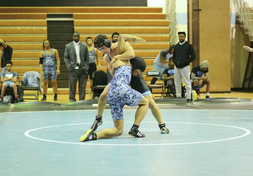 170lb Ezra Alexander begins a pin combination in his win against a Digital Harbor opponent. Photo by Michelle Jarcho