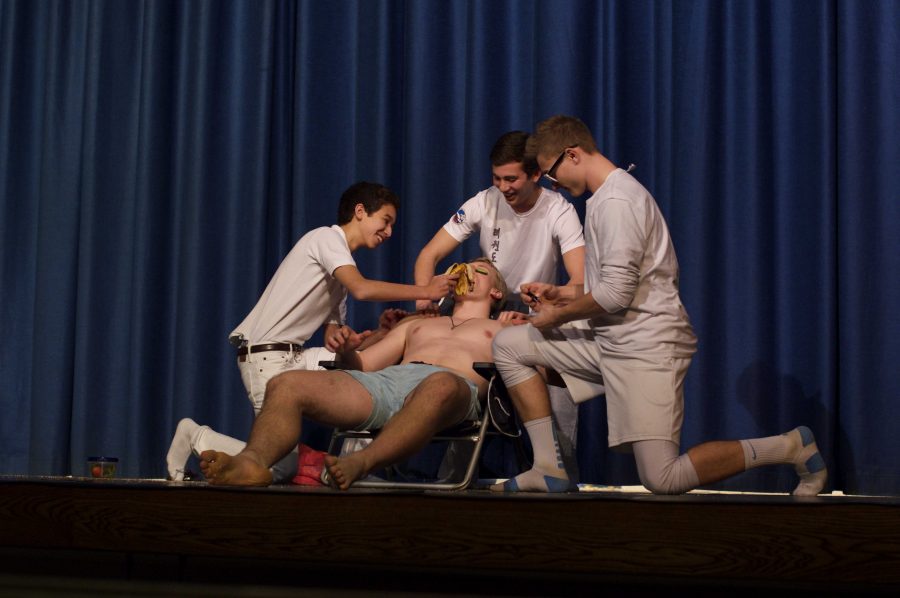 Seniors Chris Mason, Anton Casey, Caleb Kushner and Andrew Cashmere auction off a spa day. Photo by Nick Anderson.