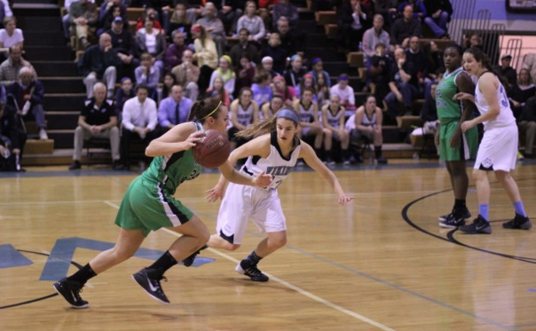 Guard Nicole Fleck plays tough defense against her Wildcat opponent in Fridays win over WJ. Photo by Jonah Rosen.
