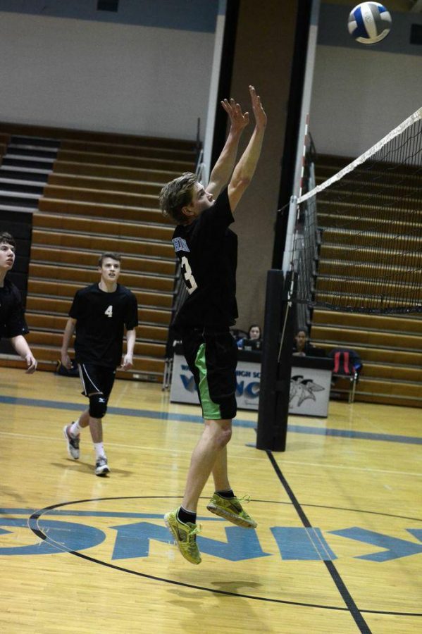 Junior Gideon Crawford goes up for a block in Tuesdays game. Photo by Michele Jarcho.
