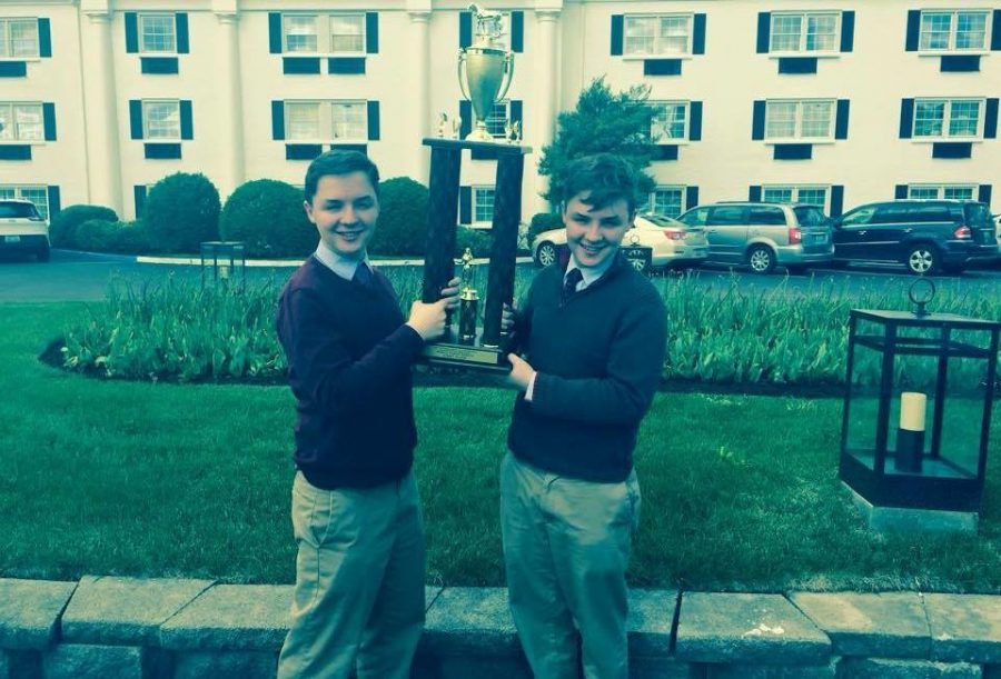 Will and Sam Arnesen (pictured left and right respectively) hoist their first place trophy after winning the Tournament of Champions at the University of Kentucky. The Arnesens also won the tournament last year, when they were co-champions with another Whitman team. Photo courtesy Will Arnesen.