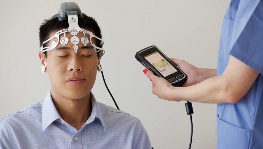 Patients test BrainScopes handheld device to evaluate its ability to quickly detect brain injuries. Students who are diagnosed with concussions may be eligible to participate in the study. Photo Courtesy of BrainScope Co. Inc.