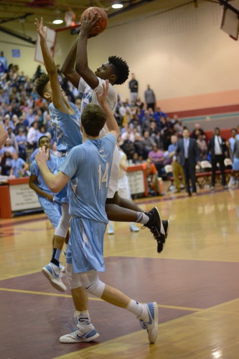 Forward Shaq Diboti-Lobe drives and draws a foul, giving the Vikes a two-point lead in the fourth quarter. Photo by Michelle Jarcho.